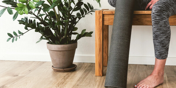 Yoga mat leaning against a bench