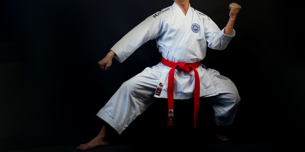 Man in jiu jitsu pose and attire