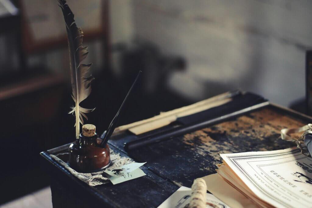 desk with writing quill